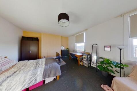 Bright and spacious bedroom featuring a double ...