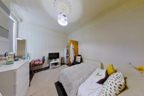 Bright and inviting master bedroom featuring a ...