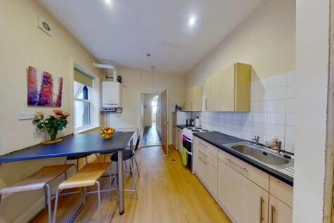 Bright and modern kitchen featuring plenty of c...