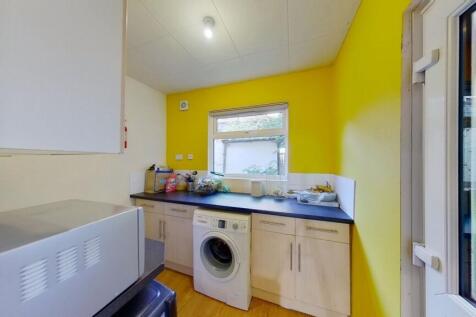 Bright and functional kitchen with vibrant yell...