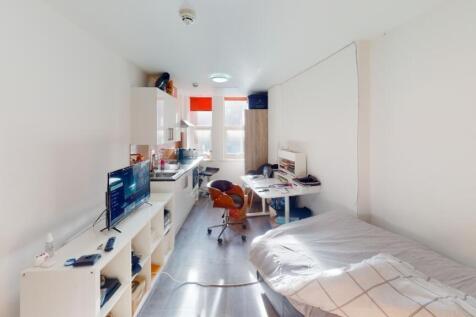 This inviting double bedroom features a cozy am...