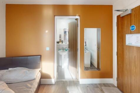 This cozy double bedroom offers a warm ambiance...