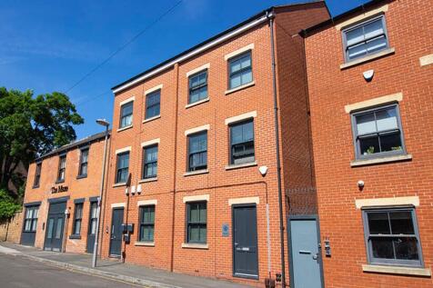 Charming red-brick facade showcasing a well-mai...