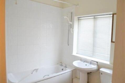 A bright and clean bathroom featuring a modern ...