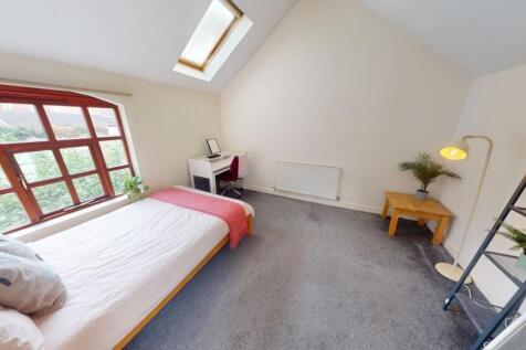 Bright and spacious master bedroom featuring a ...