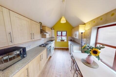 Bright and modern kitchen with ample natural li...