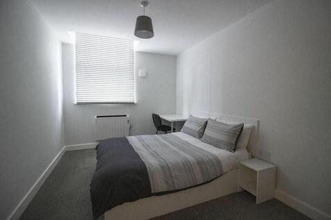 Spacious double bedroom featuring a comfortable...