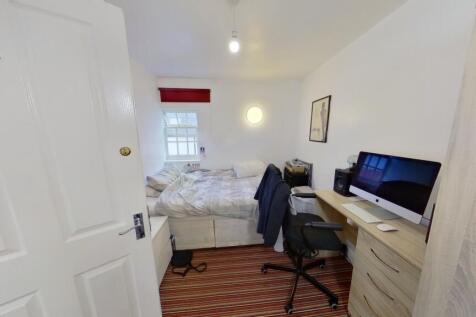 Bright and tidy double bedroom featuring a comf...