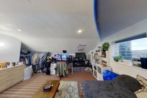 A cozy and inviting living room featuring a com...