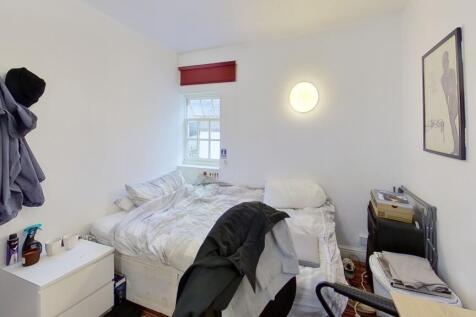 Bright and cozy double bedroom featuring a comf...
