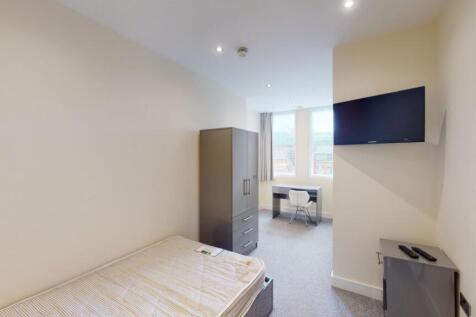 A neatly arranged single bedroom featuring a co...