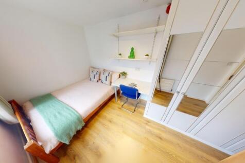Bright and clean compact toilet area featuring ...