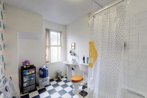 Bright and clean bathroom with classic black an...