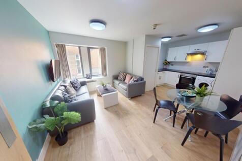 Bright and stylish open-plan living room with m...