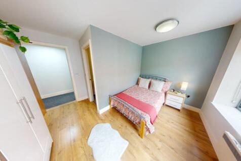 Bright and inviting double bedroom featuring a ...