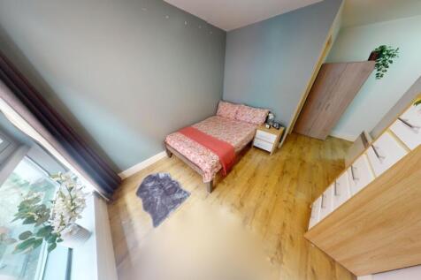 Bright and cozy single bedroom featuring a comf...