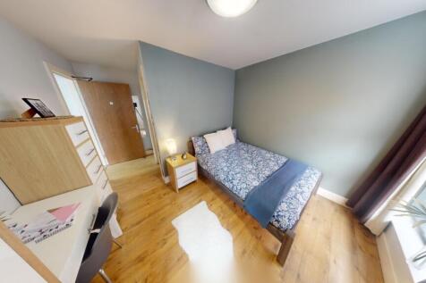 Bright and tidy single bedroom featuring a cozy...