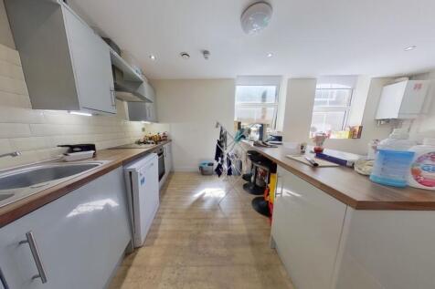 Bright and modern kitchen with ample countertop...