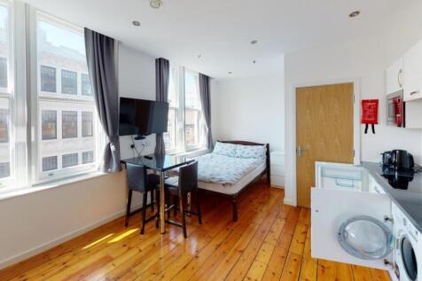 Bright and modern single bedroom with large win...