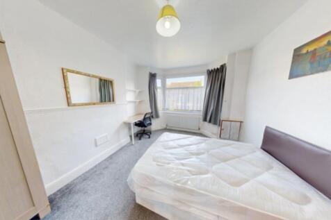 Welcoming double bedroom featuring ample natura...