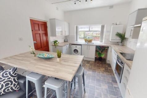 A modern and spacious kitchen with ample natura...