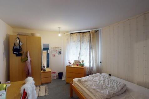 A cozy double bedroom featuring ample storage a...