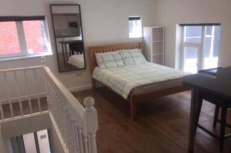 A bright and inviting double bedroom with ample...