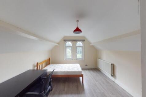 Bright and spacious attic master bedroom featur...