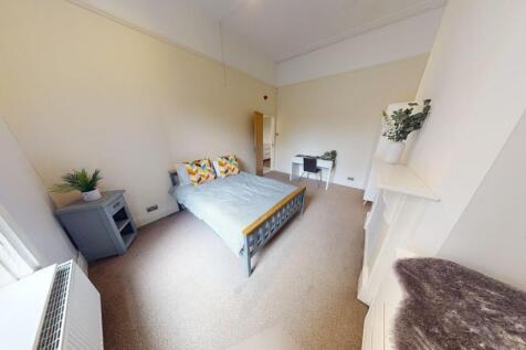 A bright and spacious master bedroom featuring ...