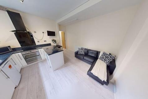Bright and modern kitchen with ample natural li...
