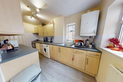 A bright and functional kitchen featuring ample...