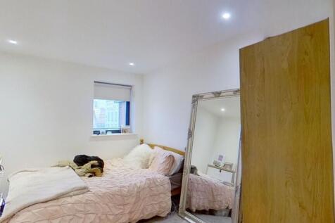 Cozy and inviting double bedroom featuring a co...