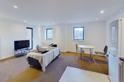 Bright and spacious living room featuring moder...