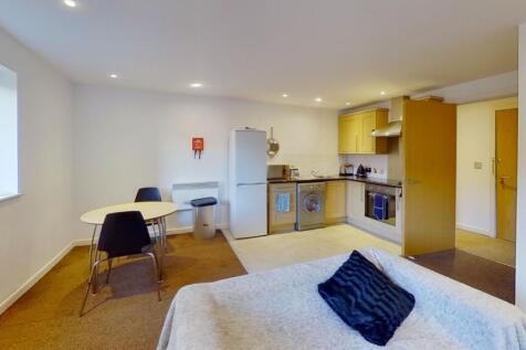 Bright and modern studio kitchen area featuring...