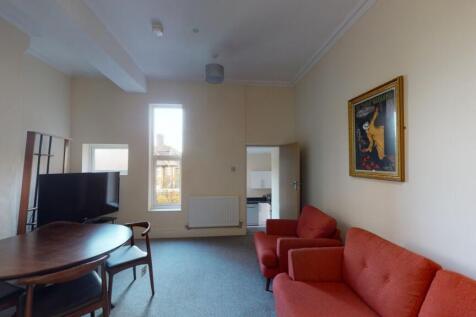 A bright and comfortable living room featuring ...