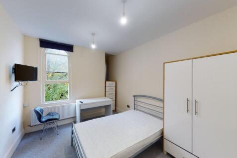 Bright and tidy double bedroom featuring a comf...