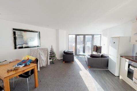 Bright and inviting living room with ample natu...