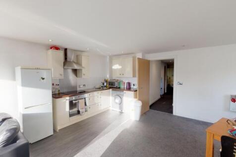 Bright and modern kitchen area featuring white ...