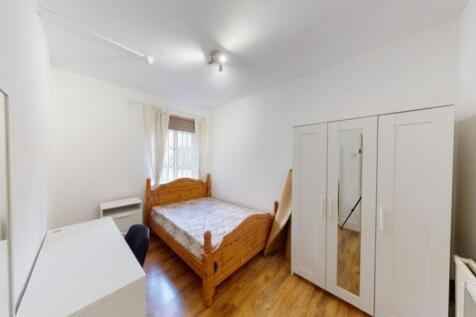 A bright and welcoming double bedroom featuring...