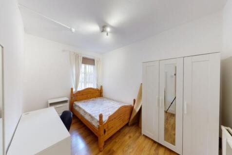 A bright and inviting double bedroom featuring ...