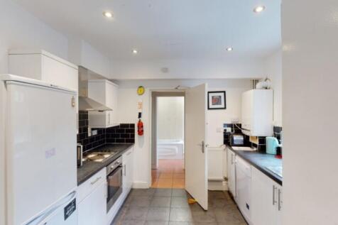 A bright and spacious kitchen featuring modern ...
