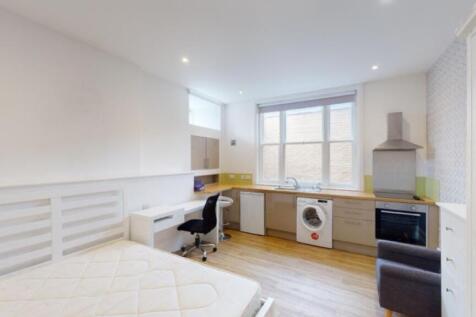 A spacious and modern kitchenette featuring amp...