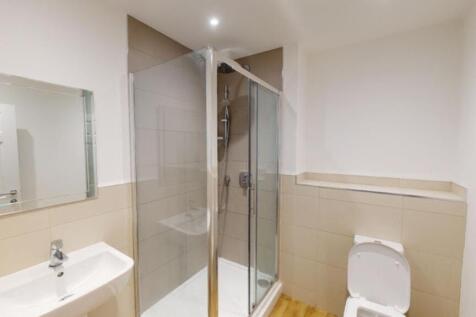 A modern and clean bathroom featuring a spaciou...