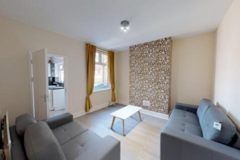 A bright and inviting living room featuring mod...