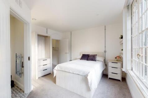 A spacious and well-lit large double bedroom, p...