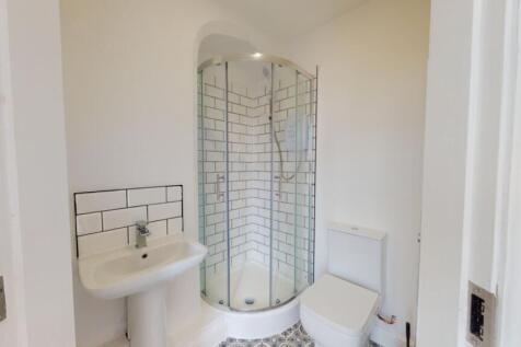 A bright and modern bathroom featuring a stylis...