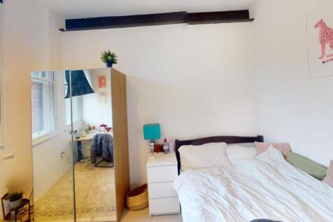 Bright and cozy double bedroom featuring a comf...