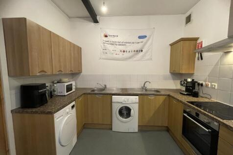 A modern, well-maintained kitchen featuring woo...