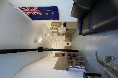 A bright communal lounge featuring comfortable ...