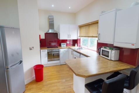A bright and tidy kitchenette featuring modern ...